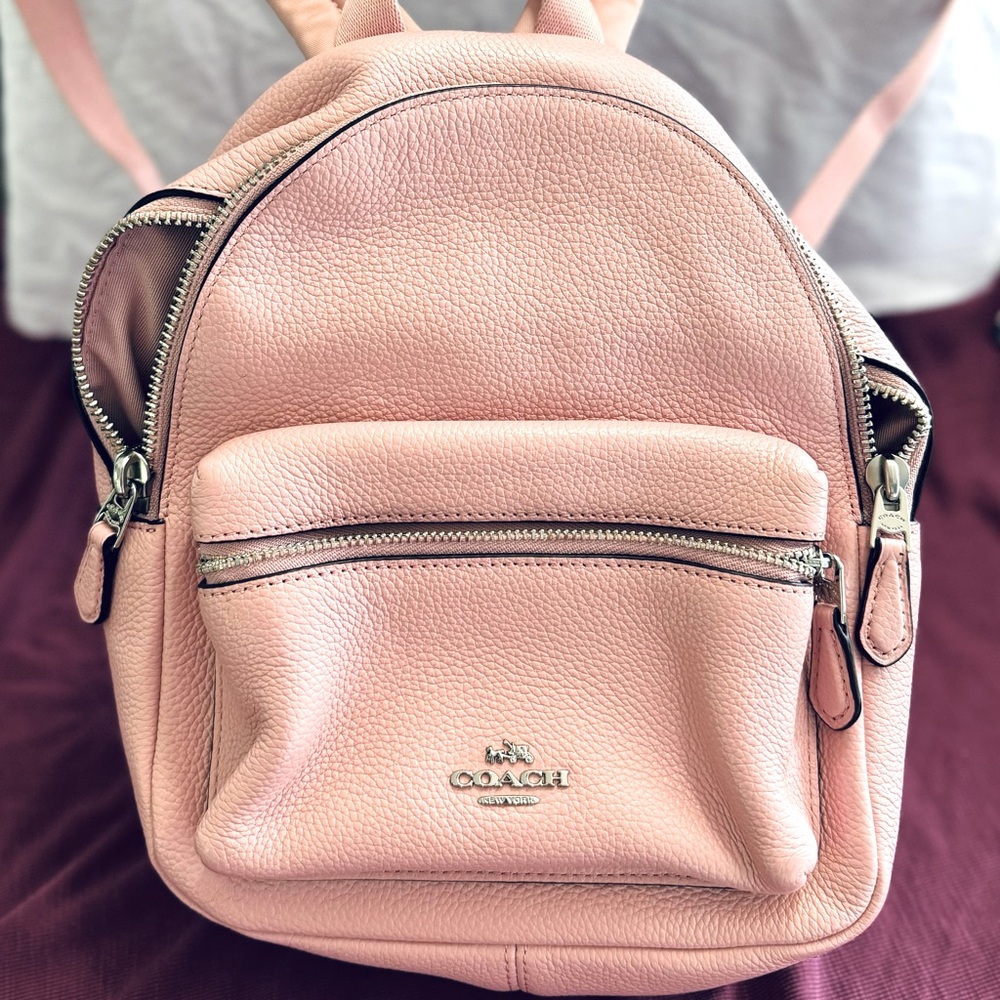 Coach pink leather mini backpack with silver hardware.